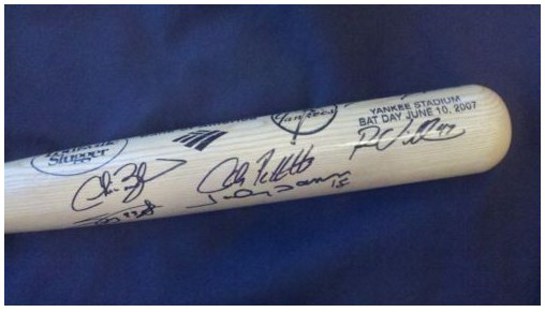 Autographed baseball bat for charity auction