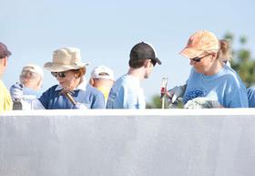 Trisha Yearwood works alongside Rosalynn Carter during Habitat for Humanity's 2011 Jimmy & Rosalynn Carter Work Project in the Santo community in Haiti.