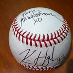 Kim Kardashian And Kris Humphries Sign Baseball For Charity Auction