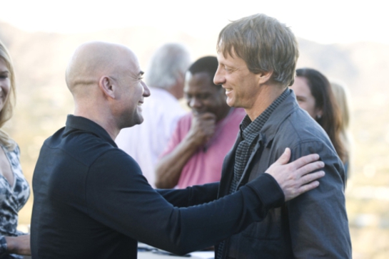 Andre Agassi greets skateboard legend Tony Hawk at philanthropic boot camp