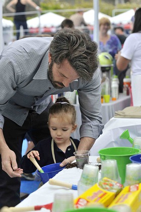 Ben Affleck shows daughter Seraphina how to be eco-friendly by helping her plant a seed at the SodaSteam eco-station during the Children Mending Hearts 4th Annual Spring Benefit