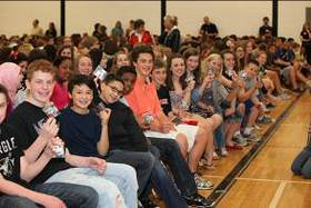 Central Middle School students pose for a photo showing off their new ear foamies courtesy of Starkey Hearing Foundation.