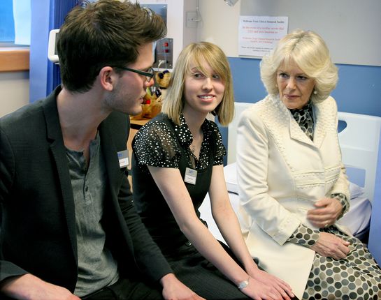 HRH The Duchess of Cornwall speaking with Jeremy Irvine, star of recent Hollywood blockbuster 'War Horse' and Hannah Day at the Addenbrooke visit