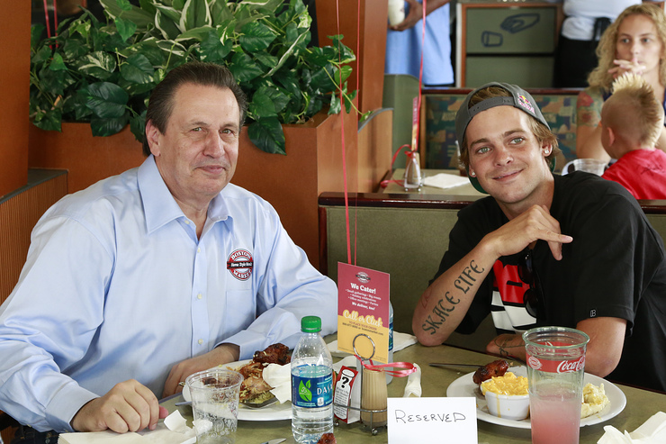 Boston Market CEO George Michel (A.K.A. The Big Chicken) and pro skateboarder Ryan Sheckler enjoy lunch at Boston Market