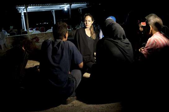 Angelina Jolie meets with refugees on the Jordanian border minutes after they crossed from Syria.