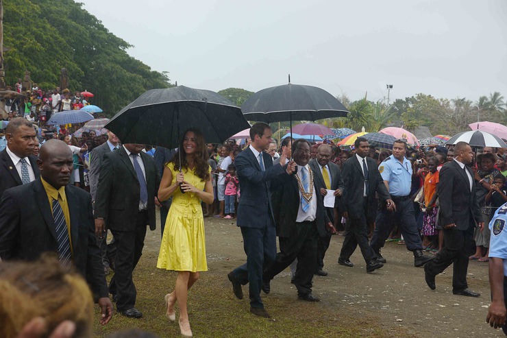 Duke and Duchess brave the rain to learn more about poverty and village life in the Solomon Islands. 