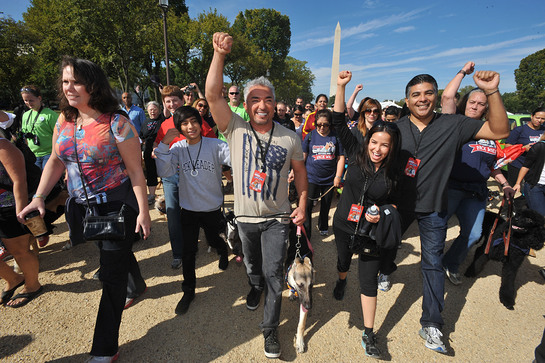 Cesar Millan leads participants and their pets around the National Mall at the Second Annual National Family Pack Walk