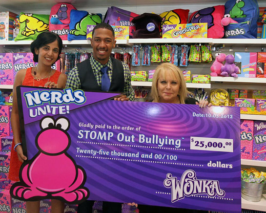 Natasha Madan, Wonka Marketing Manager, left, Nick Cannon, actor and STOMP Out Bullying Global Ambassador, center, and Ross Ellis, founder and CEO of STOMP Out Bullying join Wonka to celebrate NERDS Unite!