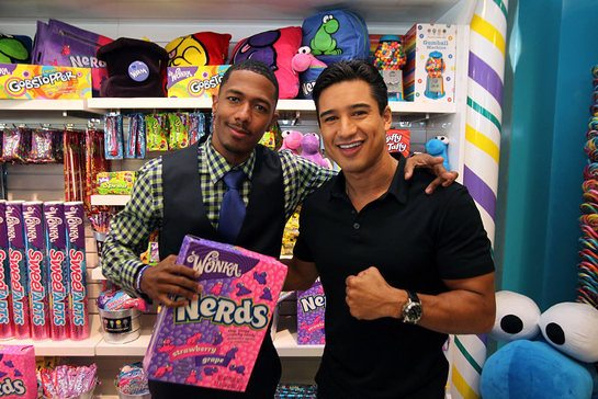 Nick Cannon, actor and STOMP Out Bullying Global Ambassador, left, poses with Mario Lopez after joining Wonka to celebrate NERDS Unite!