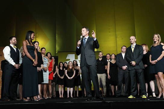 Lance Armstrong is joined on-stage at LIVESTRONG's 15th anniversary gala by Doug Ulman, LIVESTRONG President and CEO, and the foundation's staff, many of whom are cancer survivors.