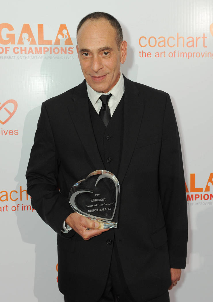 Nestor Serrano and his award on the red carpet