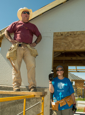 Garth Brooks and Trisha Yearwood joined Habitat for Humanity volunteers to help build 100 houses over the course of one week