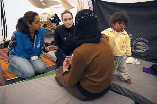 UNHCR Special Envoy Angelina Jolie meets with refugees at the Za'atri refugee camp in Jordan.