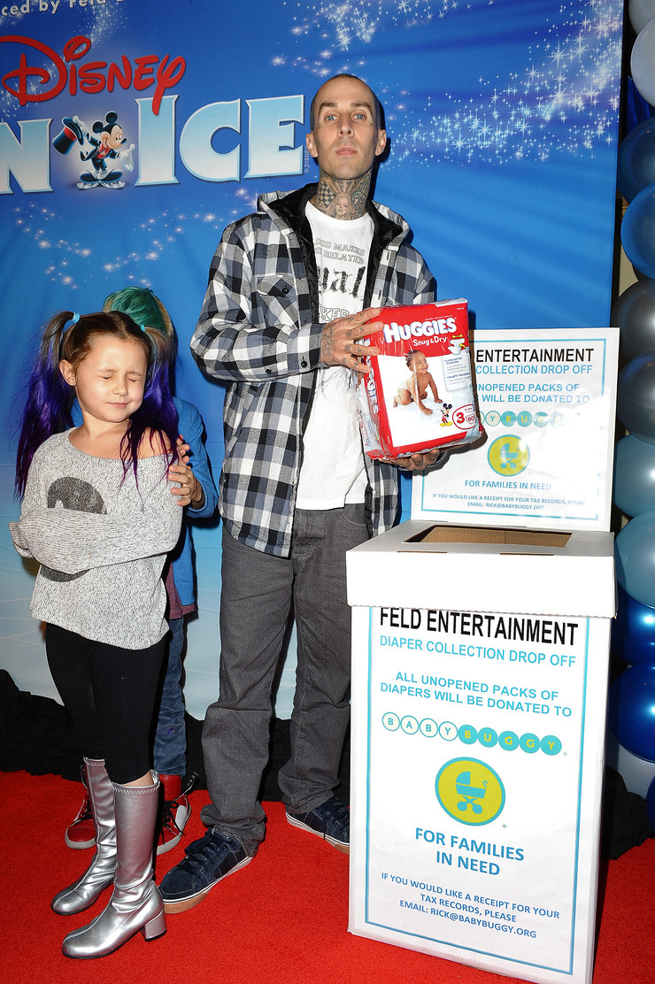 Travis Barker helps families in need by donating diapers to Baby Buggy at Disney on Ice Dare to Dream Premiere