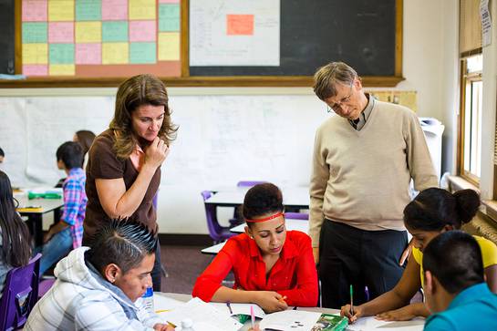 Bill and Melinda Gates, co-chairs of the Bill & Melinda Gates Foundation, work with students at South High School in Denver, Colorado. 