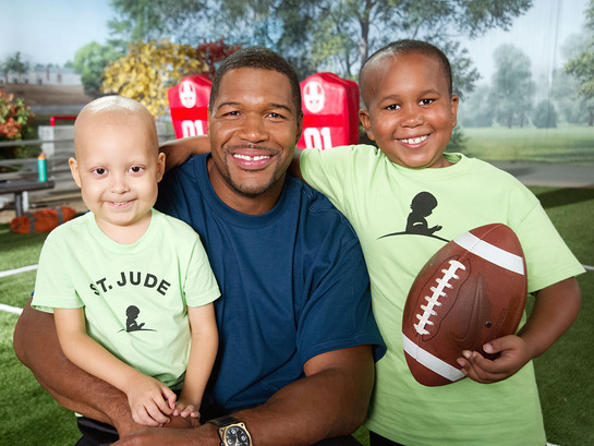 Michael Strahan celebrates St. Jude Game Day. Give Back with patients Estevan and Marion to prepare for the big game. 