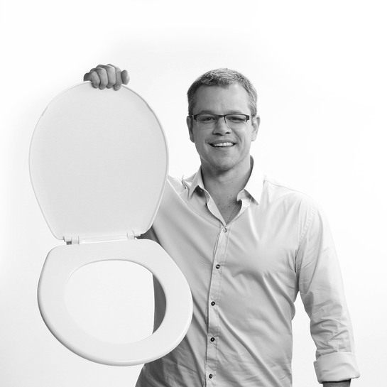 Water.org's Matt Damon holds up a toilet seat in protest of the 2.5 billion people who don't have access to clean water and sanitation