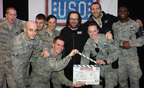 Troops pose with director John Moore, center, and Jai Courtney following the movie.