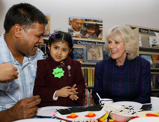 The Duchess of Cornwall meets father and daughter Kabir Miah and Shakira Begum, four, during a visit to West Greenwich Library in London.