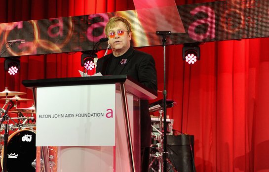 Sir Elton John speaks onstage during Chopard at 21st Annual Elton John AIDS Foundation Academy Awards Viewing Party Sir Elton John speaks onstage during Chopard at 21st Annual Elton John AIDS Foundation Academy Awards Viewing Party