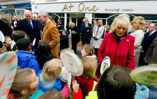 Prince of Wales and The Duchess of Cornwall talk to school children during a visit to Braunton in North Devon which was affected by recent flooding
