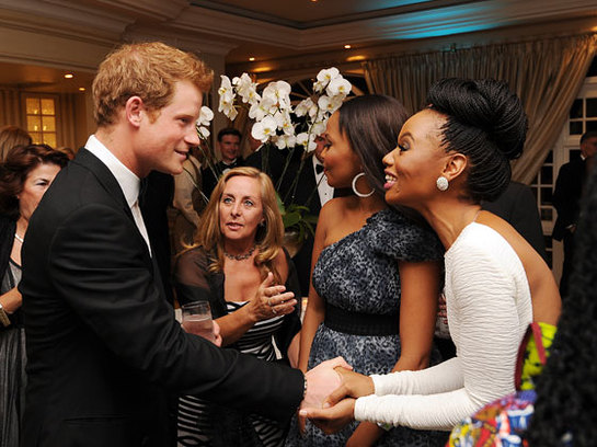 Prince Harry talks to guests at a drinks reception at the Sentabale Gala dinner at the Summer Place in Sandton, Johannesburg