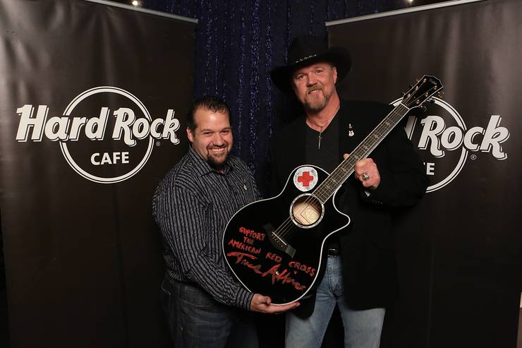 Trace Adkins appears with Hard Rock representative, John Pasquale, as he donates his hand-painted guitar to Hard Rock’s world famous memorabilia collection as part of the most recent challenge on NBC’s All-Star Celebrity Apprentice,