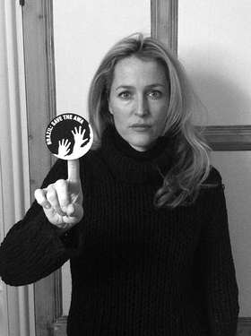 Hollywood star Gillian Anderson brandishes the awáIcon which sends the urgent message, 'Brazil: Save the Awá'. Hollywood star Gillian Anderson brandishes the awáIcon which sends the urgent message, 'Brazil: Save the Awá'.