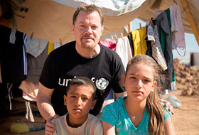 Eddie meets 10-year-old Mohammed and his sister at Domiz camp.