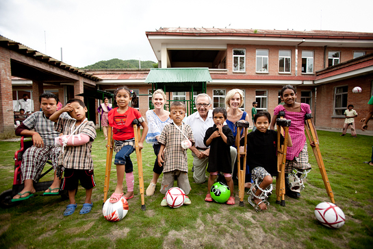 Stephanie March and World of Children Award Co-founders Harry Leibowitz and Kay Isaacson-Leibowitz with group of children at the Hospital and Rehabilitation Centre for Disabled Children in Nepal 