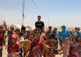 Pau Gasol visits children at the Domiz refugee camp in Iraq.