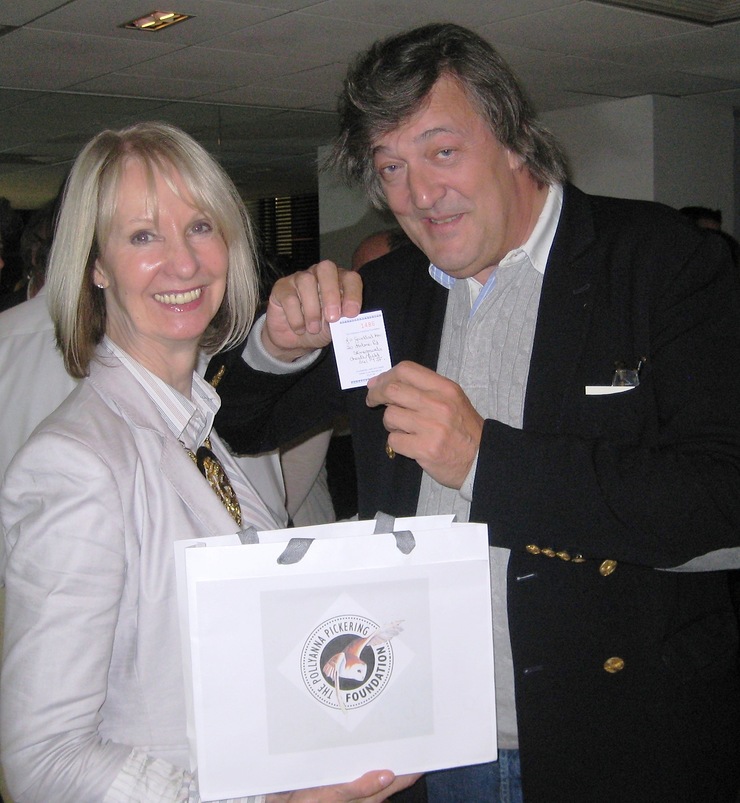 Stephen Fry and Pollyanna Pickering drawing the winning ticket