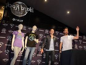 Mike Shinoda and Chester Bennington of Linkin Park unveil Hard Rock's new Linkin Park Signature Series: Edition 31 T-Shirt during a press conference held at Hard Rock Cafe Tokyo on Friday, August 9, 2013, in Roppongi.