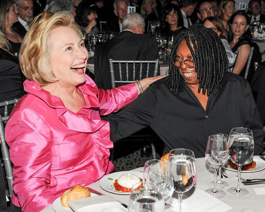 Former Secretary of State Hillary Rodham Clinton has a laugh with actor and television personality Whoopi Goldberg.