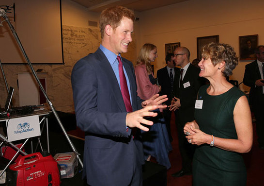 Prince Harry with Chief Executive Liz Hughes (right) at a reception for MapAction at the Royal Society, London.