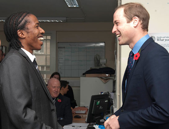 The Duke of Cambridge talks to Junior Smart the SOS Business Relationship Manager as he visits the head office of the St Giles Trust in Camberwell, London