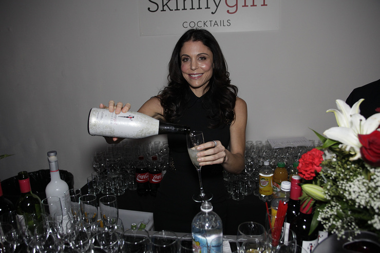 Guest mixologist Bethenny Frankel jumps behind the Skinnygirl® Cocktails bar at Dress for Success’ Shop for Success VIP Party on Saturday, November 9, 2013 in New York City. 