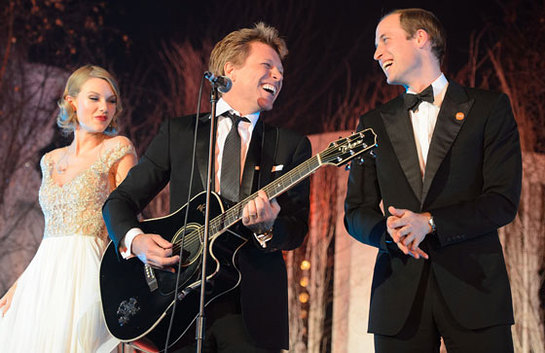 The Duke of Cambridge performs on stage with Bon Jovi and Taylor Swift