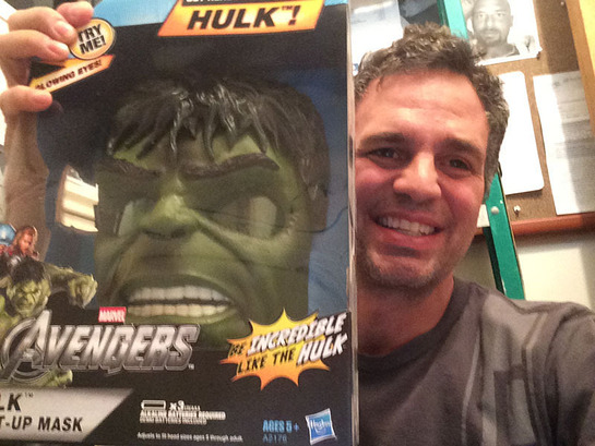 Mark Ruffalo holds a boxed Hulk mask that he will sign for one lucky winner in the online auction