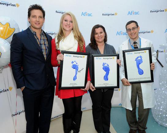 Left to right is Facinelli, childhood cancer survivor Morgan Zuch, Abigail Slaven, RN and Dr. Jonathan Fish. The trio were honored by Aflac for their outstanding commitment to children and families facing cancer.