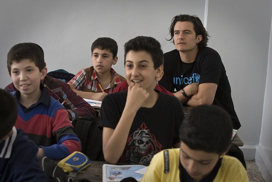 Orlando Bloom joins students during a Grade 6 English class, at Omar Bin Abdul Aziz Boys School in the northern city of Irbid, capital of Irbid Governorate