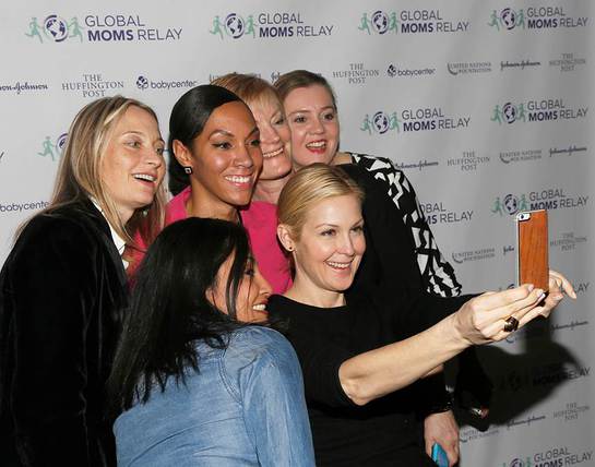 Kelly Rutherford takes a selfie with digital Moms during the premier of the new Global Moms Relay video 