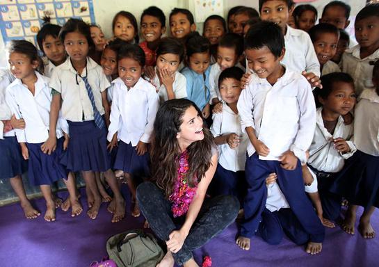 UNICEF Ambassador, Selena Gomez enjoys a sweet moment with a student while the early childhood education class gathers for a group photo at Satbariya Rapti Secondary School UNICEF Ambassador, Selena Gomez enjoys a sweet moment with a student while the early childhood education class gathers for a group photo at Satbariya Rapti Secondary School
