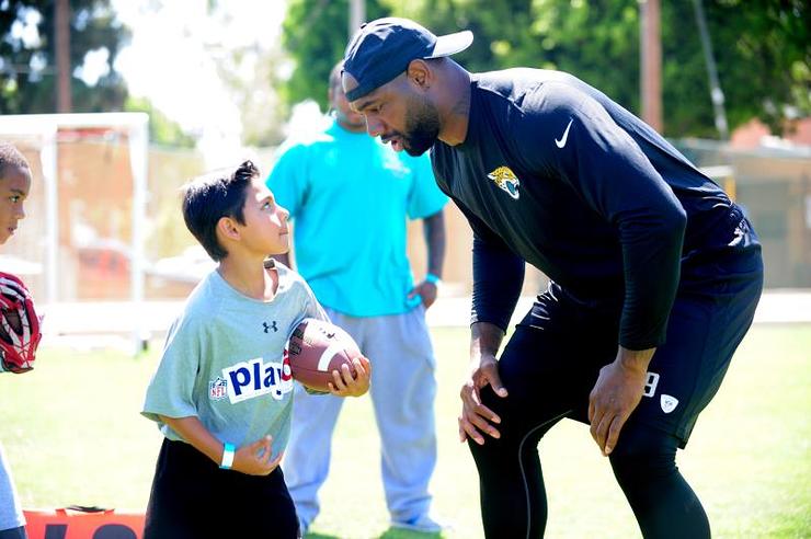 Marcedes Lewis and friend at the sixth annual Marcedes Lewis Foundation Football Camp