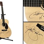 Paul Simon Signs Guitar With Dave Matthews And Aaron Neville For Auction