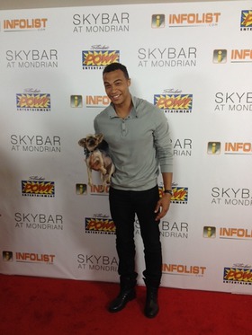 Dale Moss Holds Rescued Half Blind Yorkshire Terrier on Pre-Comic-Con Red Carpet in West Hollywood, Calif.