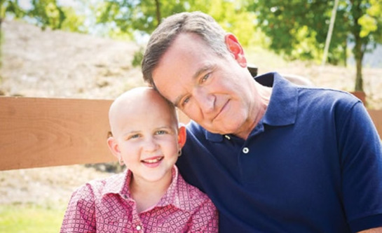 Robin Williams with St. Jude patient Darcy in 2013