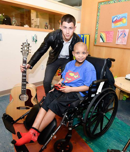 Nick Jonas With A Patient At Children's Hospital at Montefiore