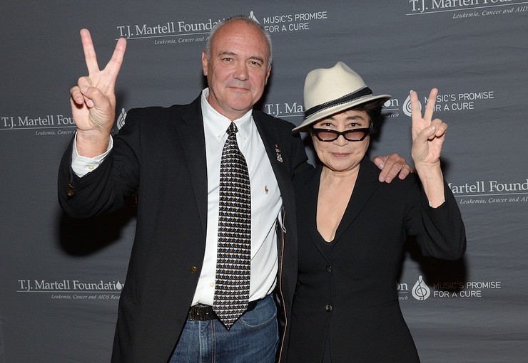 Yoko Ono Lennon poses on the red carpet with Hard Rock International President and CEO Hamish Dodds