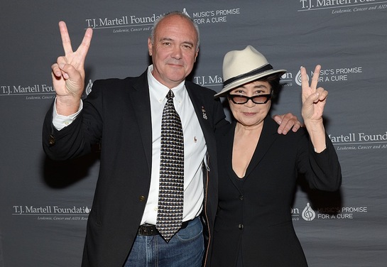 Yoko Ono Lennon poses on the red carpet with Hard Rock International President and CEO Hamish Dodds